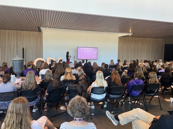 Kelly Hobbs presenting at a speaking event